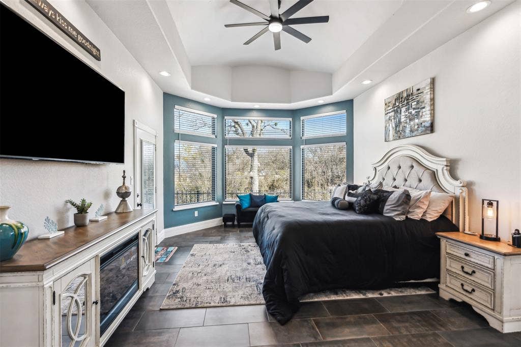 2100 Gene Court, Granbury, TX 76048 Spacious room featuring dark tile flooring, a vaulted ceiling, and recessed lighting