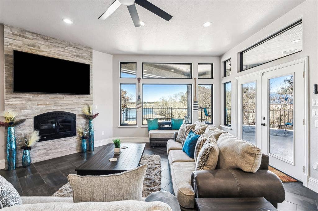 2100 Gene Court, Granbury, TX 76048 Wood burning fireplace living room with a lake view!