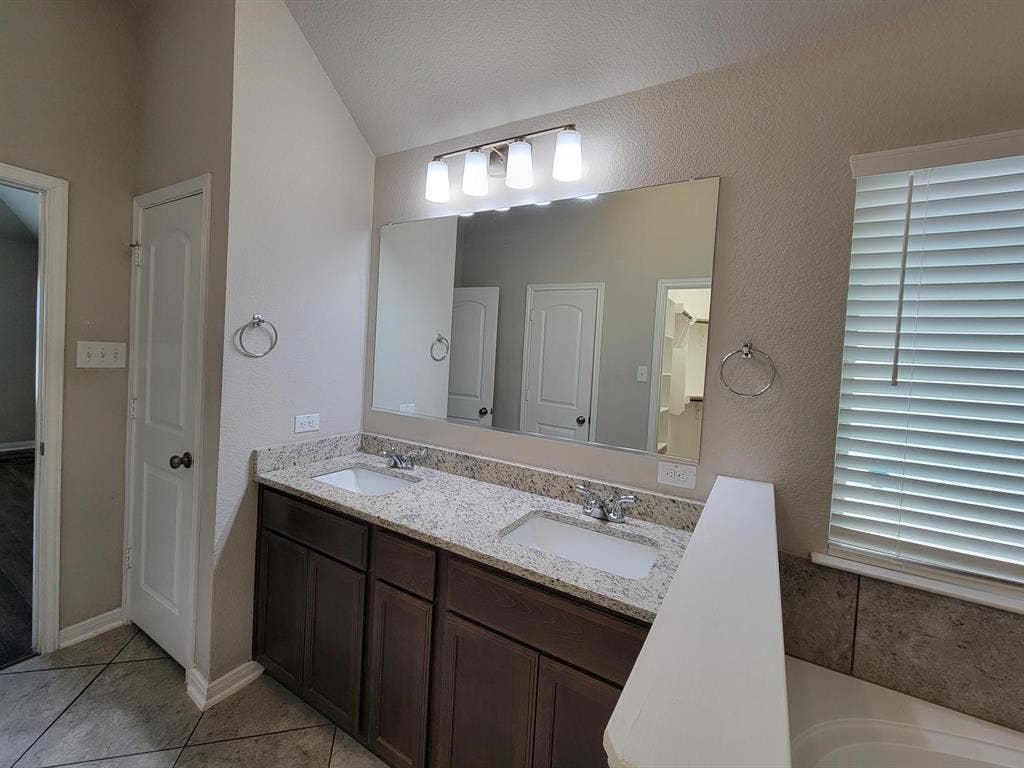 1106 Placid Circle, Waco, TX 76706 Double vanity with granite-style countertop and integrated sinks