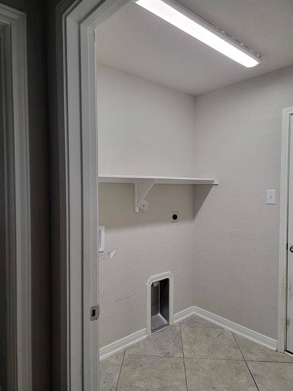 1106 Placid Circle, Waco, TX 76706 Dedicated laundry area featuring ceramic tile flooring, a built-in shelf, and a ceiling-mounted fluorescent light fixture