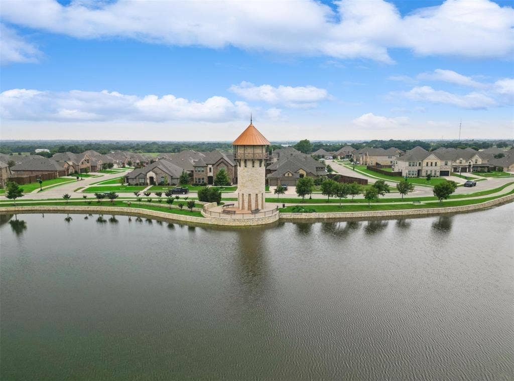 3004 Chesterfield Lane, Mansfield, TX 76084 Pond and Tower at Front of Neighborhood