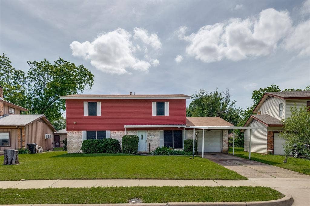3013 Margo Drive, Mesquite, TX 75150 Two-story residence featuring red siding and a light brick lower facade