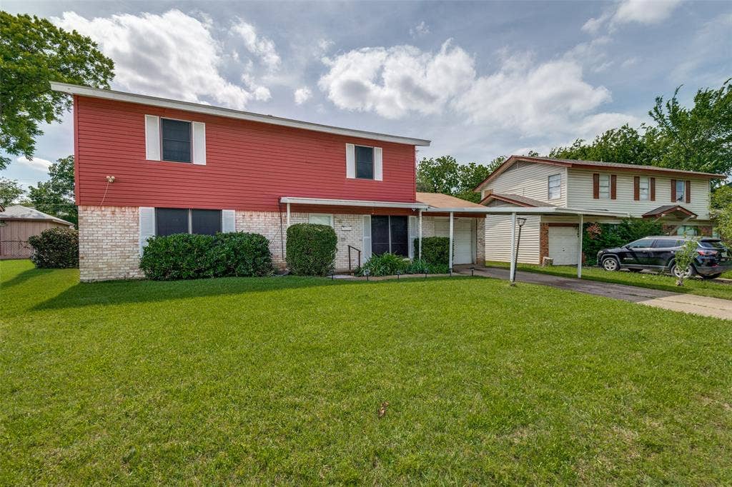 3013 Margo Drive, Mesquite, TX 75150 Two-story residence featuring red siding and a white brick facade