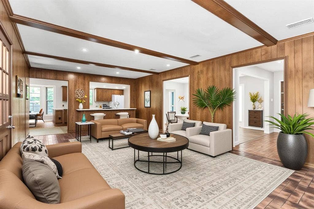 101 Hollyhill Lane, Denton, TX 76205 Living space featuring wood-paneled walls, exposed wood ceiling beams, recessed lighting, and wood-finish flooring