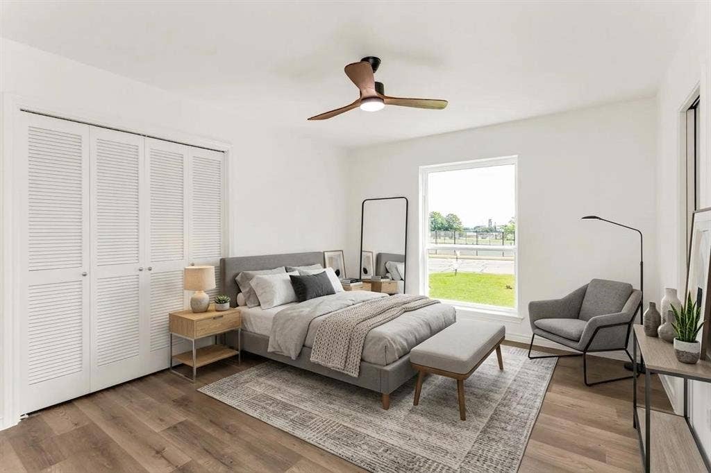 101 Hollyhill Lane, Denton, TX 76205 Bright interior featuring wood-finish flooring, a contemporary ceiling fan, and a wide window