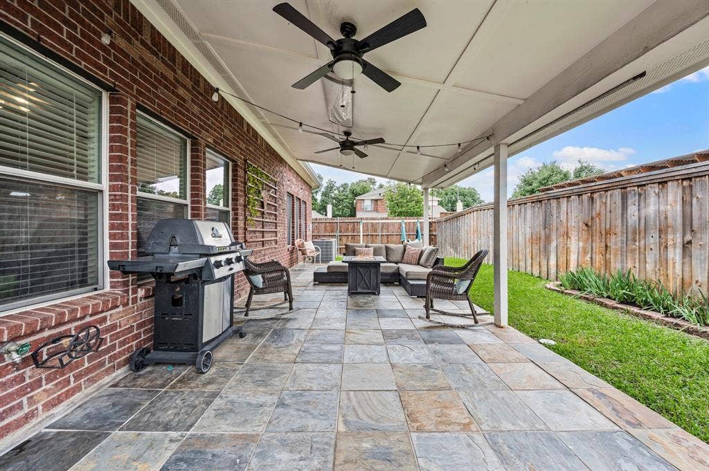 308 Bradbury Drive, Euless, TX 76040 Extended covered patio creates the perfect setting for relaxing evenings or weekend gatherings.
