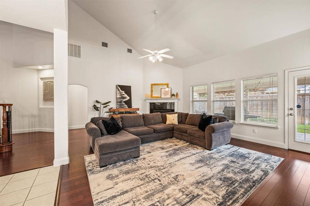 308 Bradbury Drive, Euless, TX 76040 Bright & open family room with rich hardwood flooring & incredible natural light.