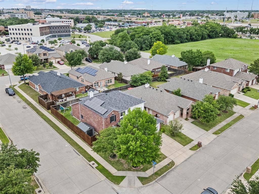 308 Bradbury Drive, Euless, TX 76040 Aerial view showcasing the paid-off solar panels, oversized lot & unbeatable Euless location near shopping, dining & DFW Airport!