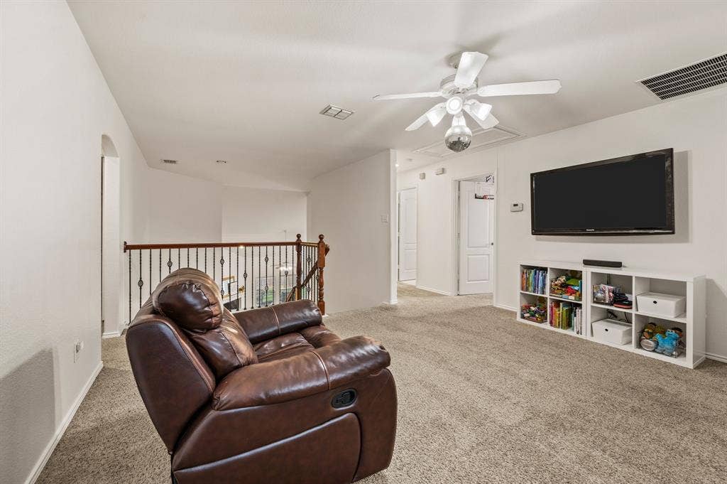 308 Bradbury Drive, Euless, TX 76040 Expansive upstairs flex space perfect for a game room, playroom or second living area.