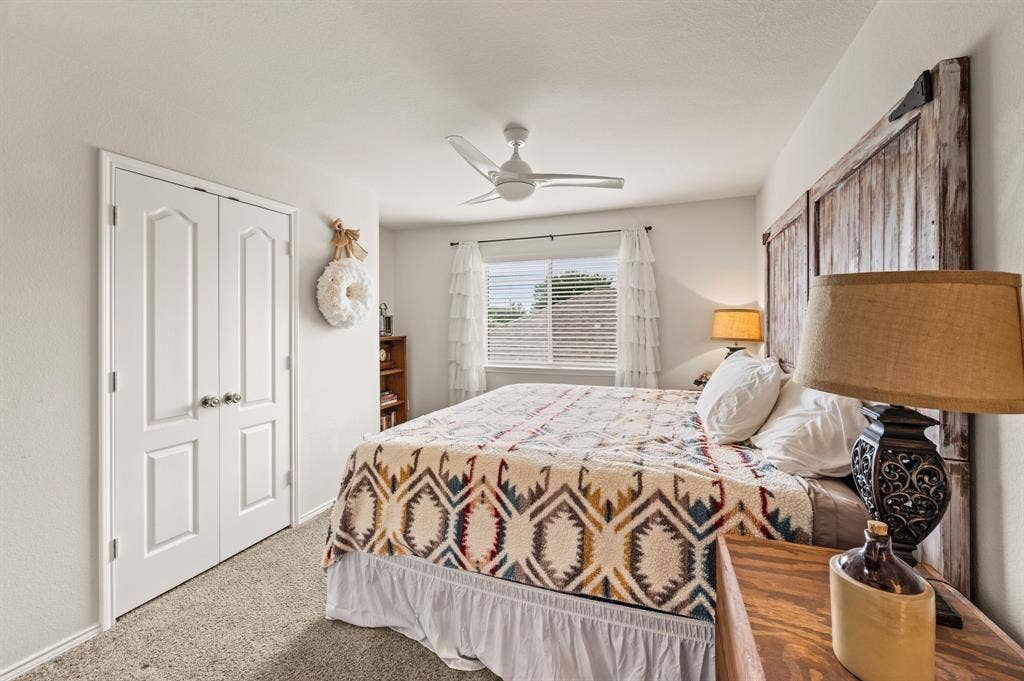 308 Bradbury Drive, Euless, TX 76040 Comfortable guest bedroom with neutral tones & versatile layout options.