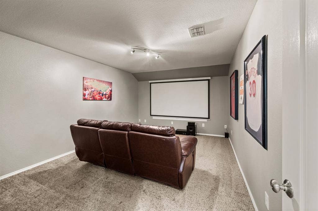 308 Bradbury Drive, Euless, TX 76040 Dedicated media room ready for movie nights, game days & entertaining.