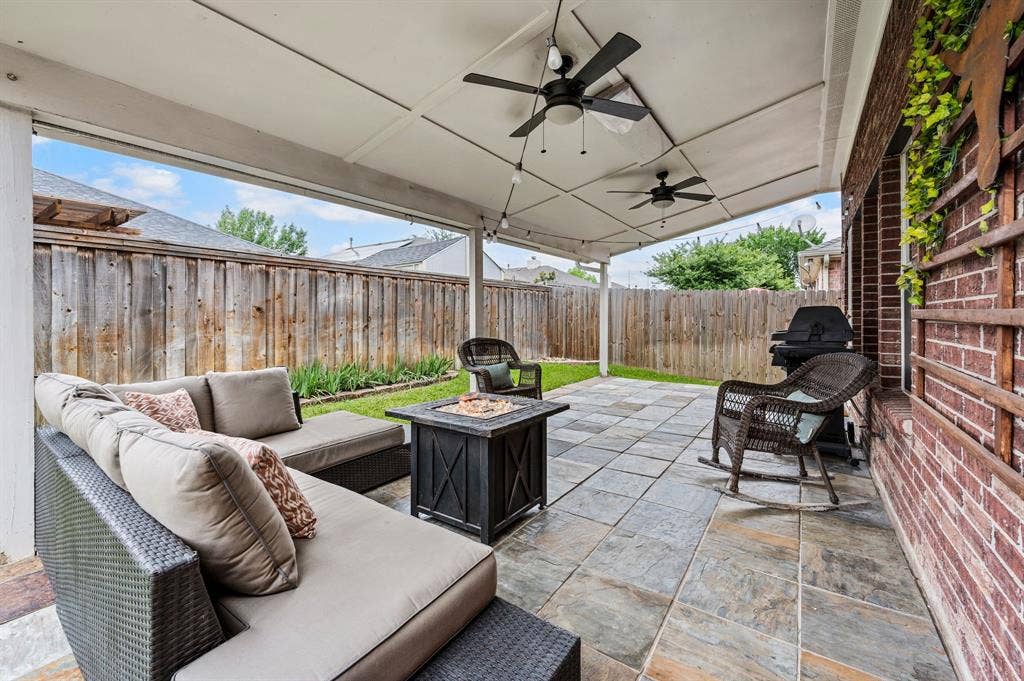 308 Bradbury Drive, Euless, TX 76040 Incredible covered patio with outdoor living space, ceiling fans & room to entertain year-round.