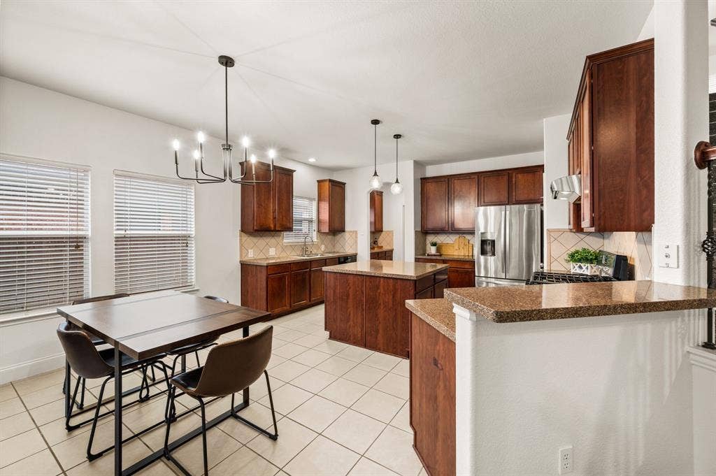 308 Bradbury Drive, Euless, TX 76040 Chef-inspired kitchen featuring granite countertops, gas cooking & tons of prep space.