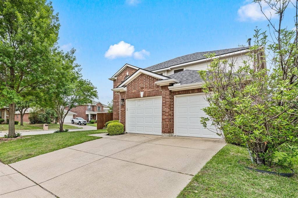308 Bradbury Drive, Euless, TX 76040 Spacious driveway & side-entry feel create a welcoming first impression with plenty of parking space.
