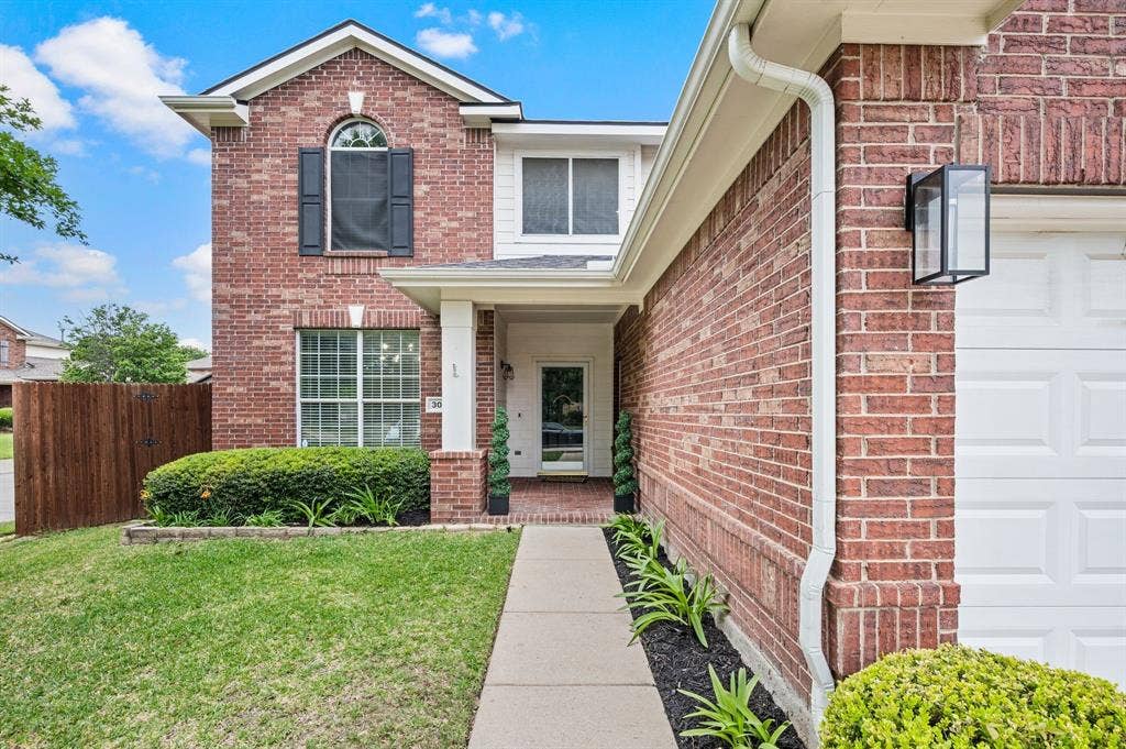 308 Bradbury Drive, Euless, TX 76040 Inviting covered front porch perfect for greeting guests in style.