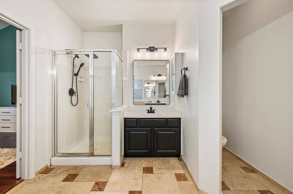 308 Bradbury Drive, Euless, TX 76040 Separate vanity & shower area create a true spa-inspired primary bathroom experience.