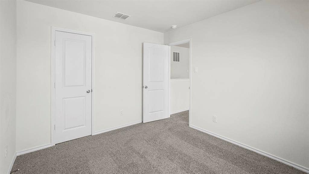 1619 Blaire Drive, Tyler, TX 75702 Room with light gray carpet, white walls, and white baseboards