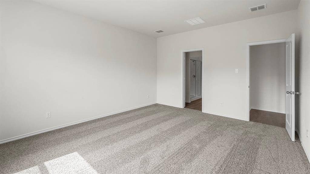 1619 Blaire Drive, Tyler, TX 75702 Spacious room featuring light gray carpet flooring, white walls, and white trim