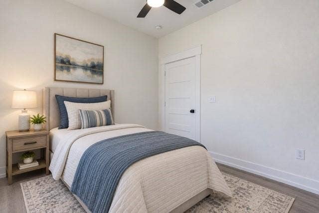 2608 Cleveland Avenue, Waco, TX 76711 Virtual staging - Wood-finish flooring, crisp white walls, and a multi-paneled door with dark hardware