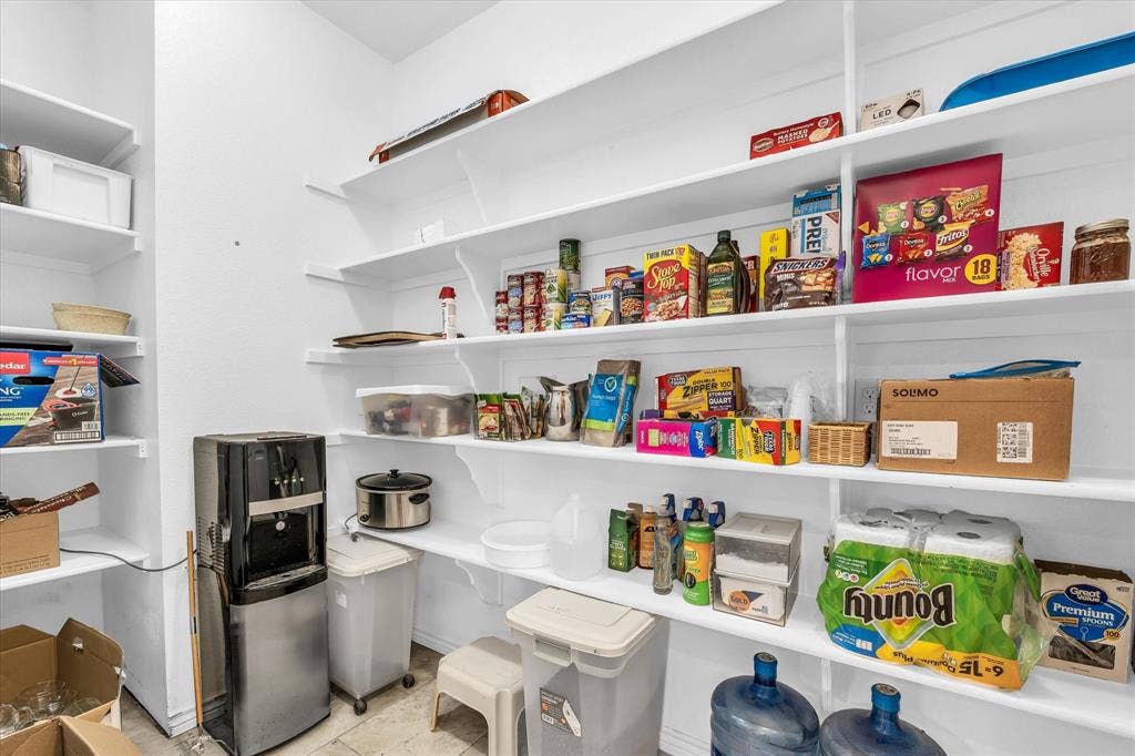 613 Bone Road, Valley Mills, TX 76689 Spacious pantry featuring multiple tiers of white shelving, offering extensive storage capacity