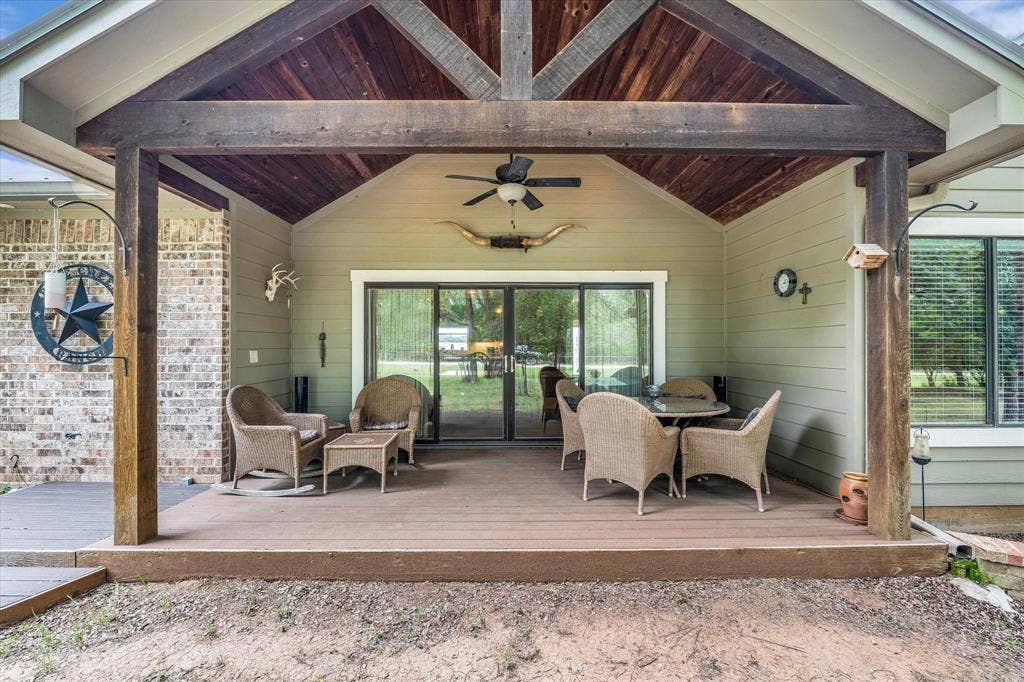 613 Bone Road, Valley Mills, TX 76689 Covered outdoor patio featuring a vaulted wood-paneled ceiling, exposed wooden beams, and a ceiling fan