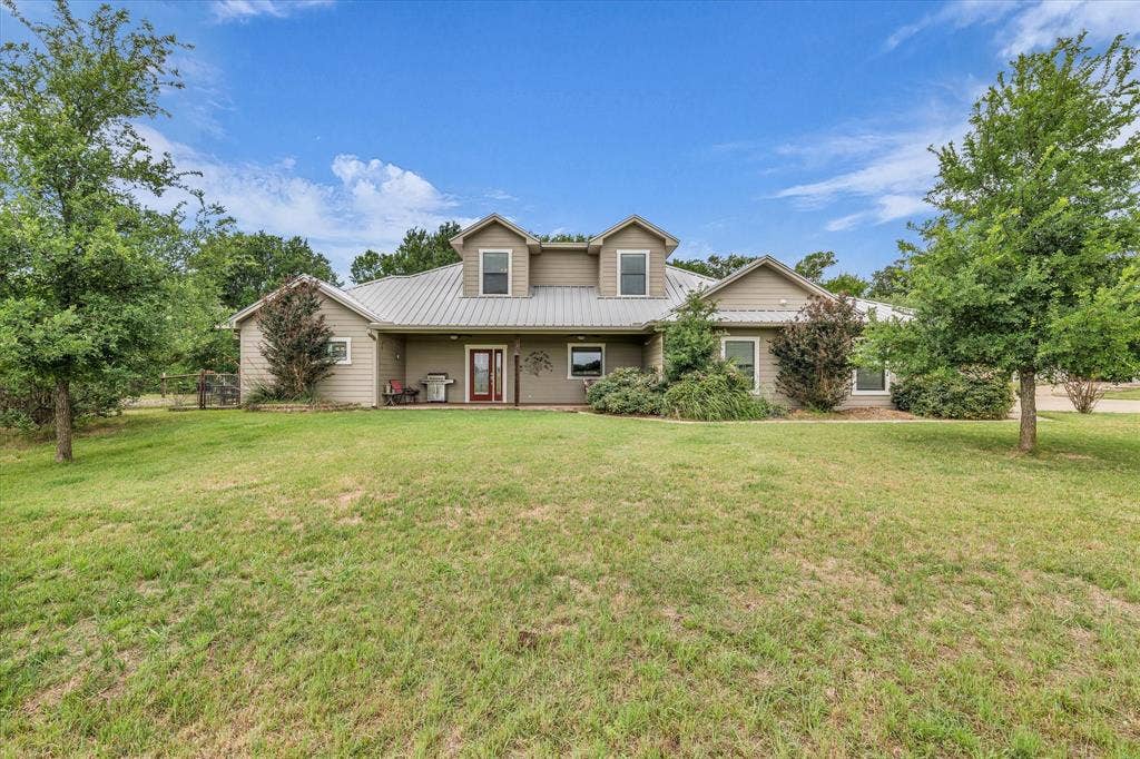 613 Bone Road, Valley Mills, TX 76689 Expansive front lawn with mature trees frames this residence
