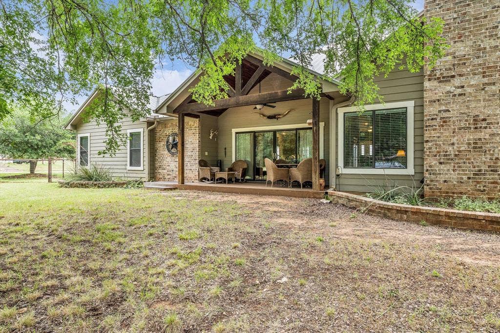 613 Bone Road, Valley Mills, TX 76689 Expansive covered patio featuring exposed timber beams, recessed lighting, and a ceiling fan