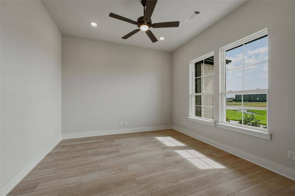 2305 Quartz Street, Krum, TX 76249 Wood-finish flooring, recessed lighting, and a ceiling fan
