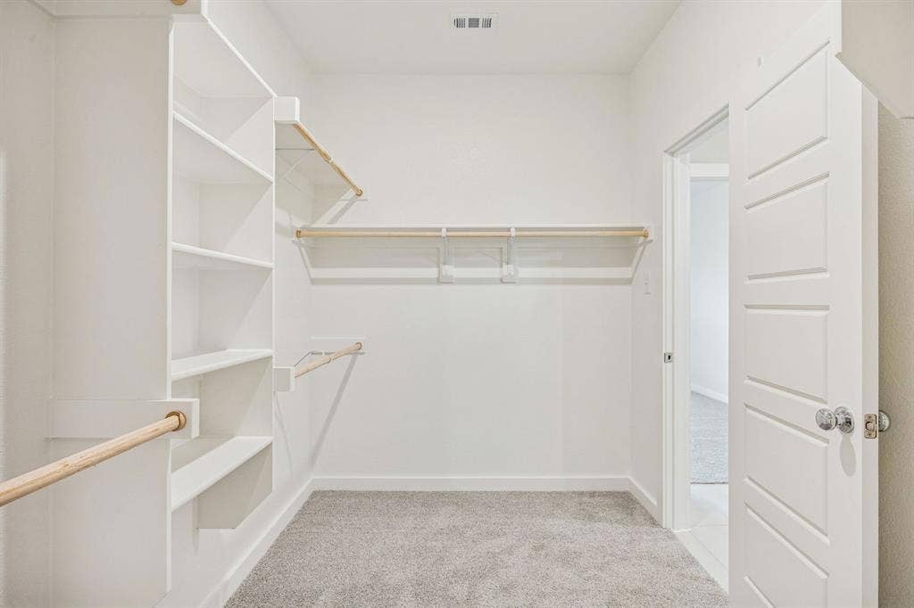 492 Hocking Hills Drive, Waxahachie, TX 75165 Primary Closet in the Stanley II home plan by Trophy Signature Homes – REPRESENTATIVE PHOTO