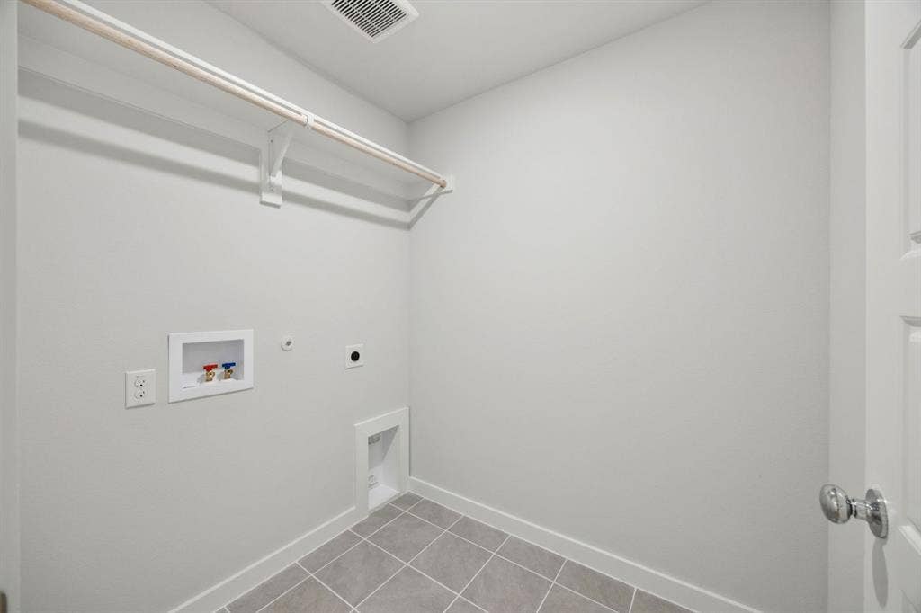 2123 Derby Drive, Seagoville, TX 75159 Utility Room in the Hadley home plan by Trophy Signature Homes – REPRESENTATIVE PHOTO