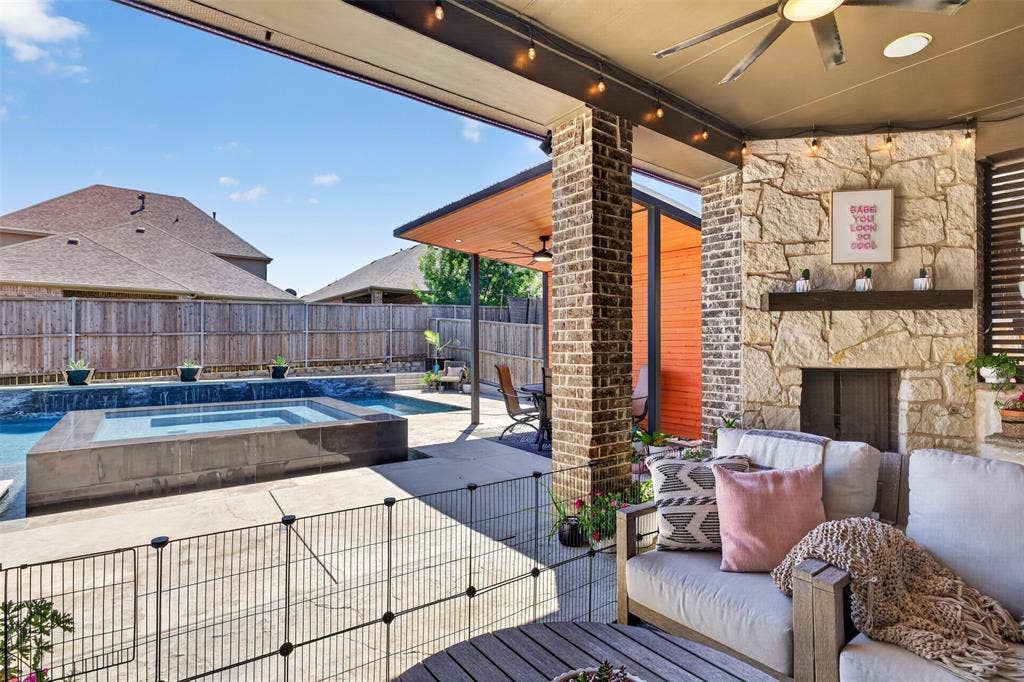 Covered patio connects directly to the pool area for easy indoor-outdoor entertaining.