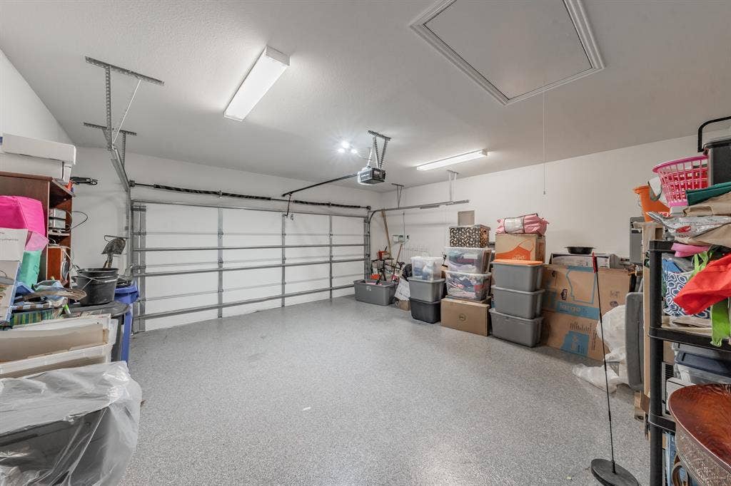 2 car garage with epoxy floor and attic access