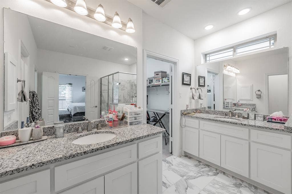 Bathroom featuring vanity and walk in shower