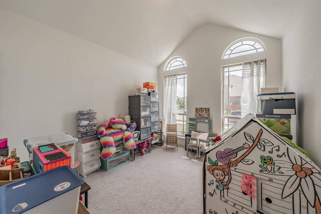 Playroom with carpet flooring is bedroom #3.