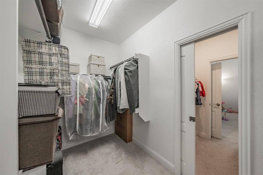 Pocket door in primary walk in closet enters bedroom #2 closet. This is a quick shortcut for their child!