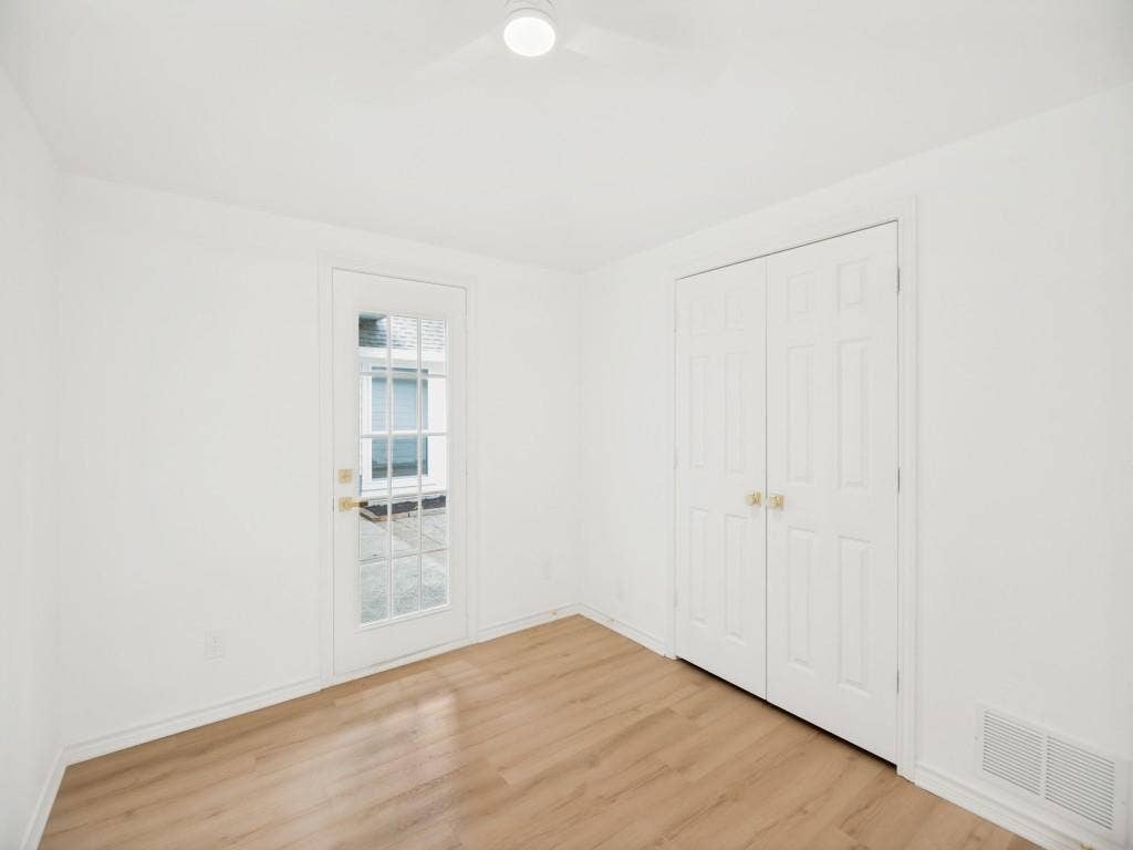 4312 Avonshire Lane, Plano, TX 75093 Room featuring light wood-finish flooring, white walls, and white trim