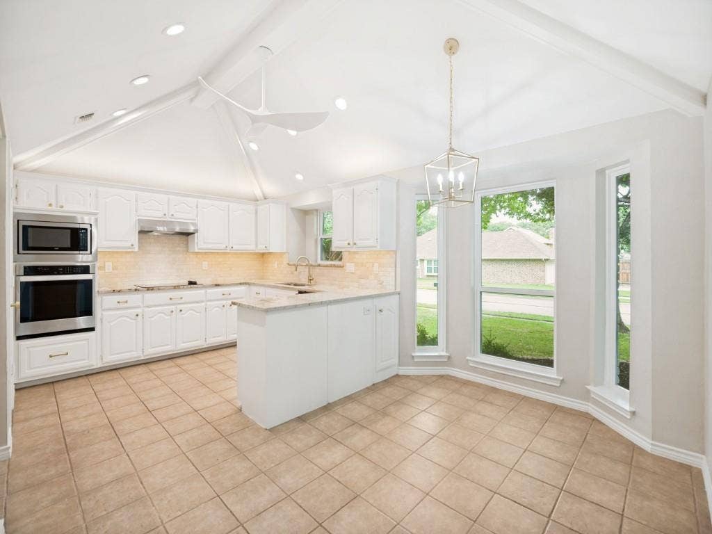 4312 Avonshire Lane, Plano, TX 75093 Kitchen featuring a vaulted ceiling, recessed lighting, and a modern ceiling fan