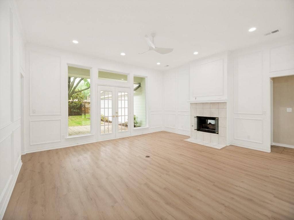 4312 Avonshire Lane, Plano, TX 75093 Spacious interior featuring wood-finish flooring, recessed lighting, and white wainscoting