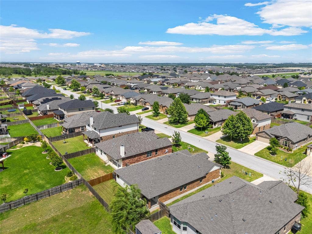 Aerial perspective showcasing a residential neighborhood with a consistent architectural style
