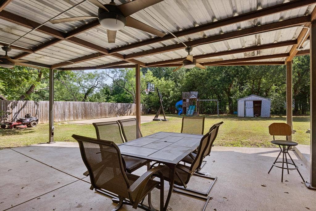 405 Granbury Court, Granbury, TX 76049 Back patio offers plenty of space for year around living and entertaining.