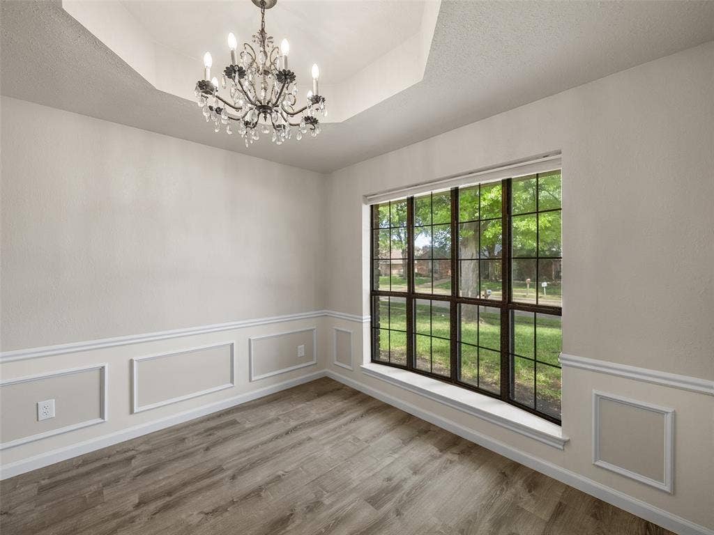 4100 Emerson Drive, Plano, TX 75093 A box Ceiling and crystal chandelier enhance the formal dining space.
