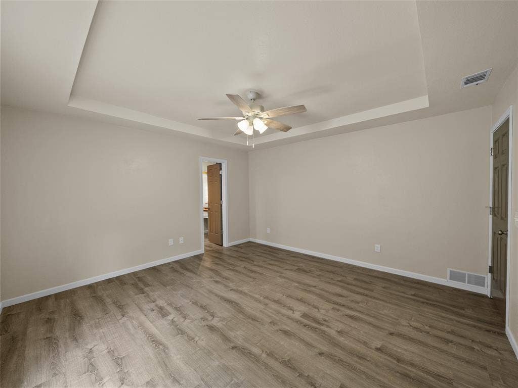 4100 Emerson Drive, Plano, TX 75093 Master bedroom offers a boxed ceiling and is spacious with ensuite bath.