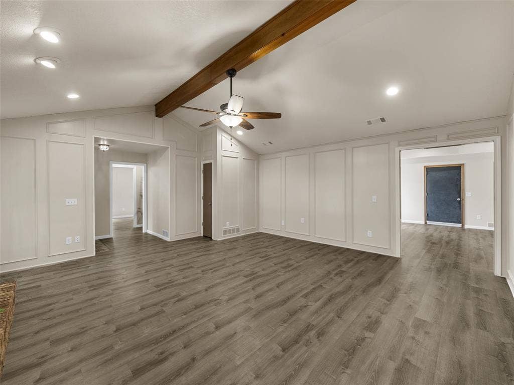 4100 Emerson Drive, Plano, TX 75093 The Living Room opens to the game room beyond and leads in the other direction to the wing with the bedrooms.