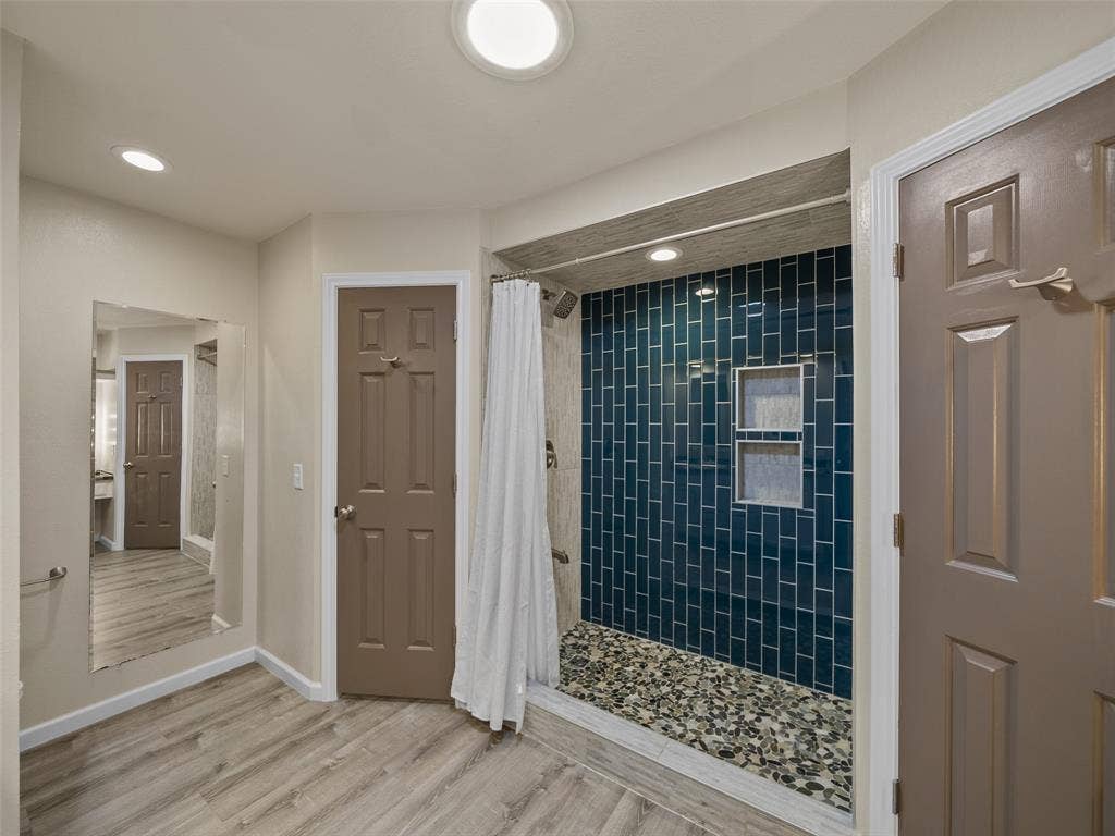 4100 Emerson Drive, Plano, TX 75093 Dual walk-in closets with built-in drawers. Above the separate commode area is additional shelving space.