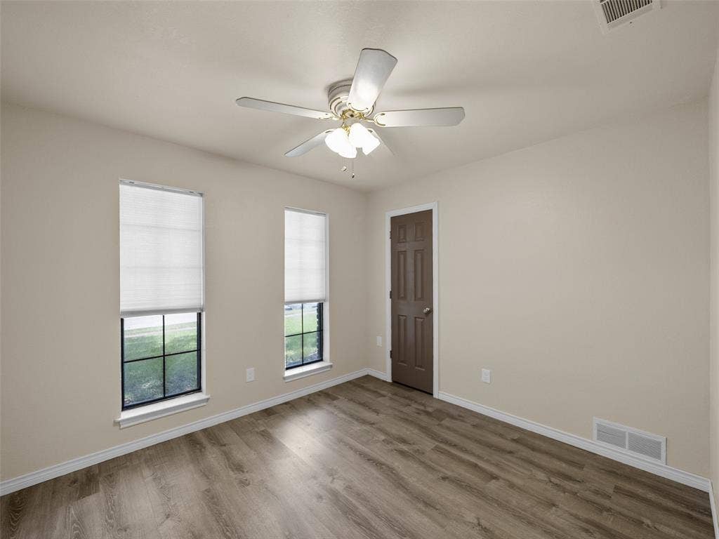 4100 Emerson Drive, Plano, TX 75093 Secondary bedroom has extra accessories in closet.