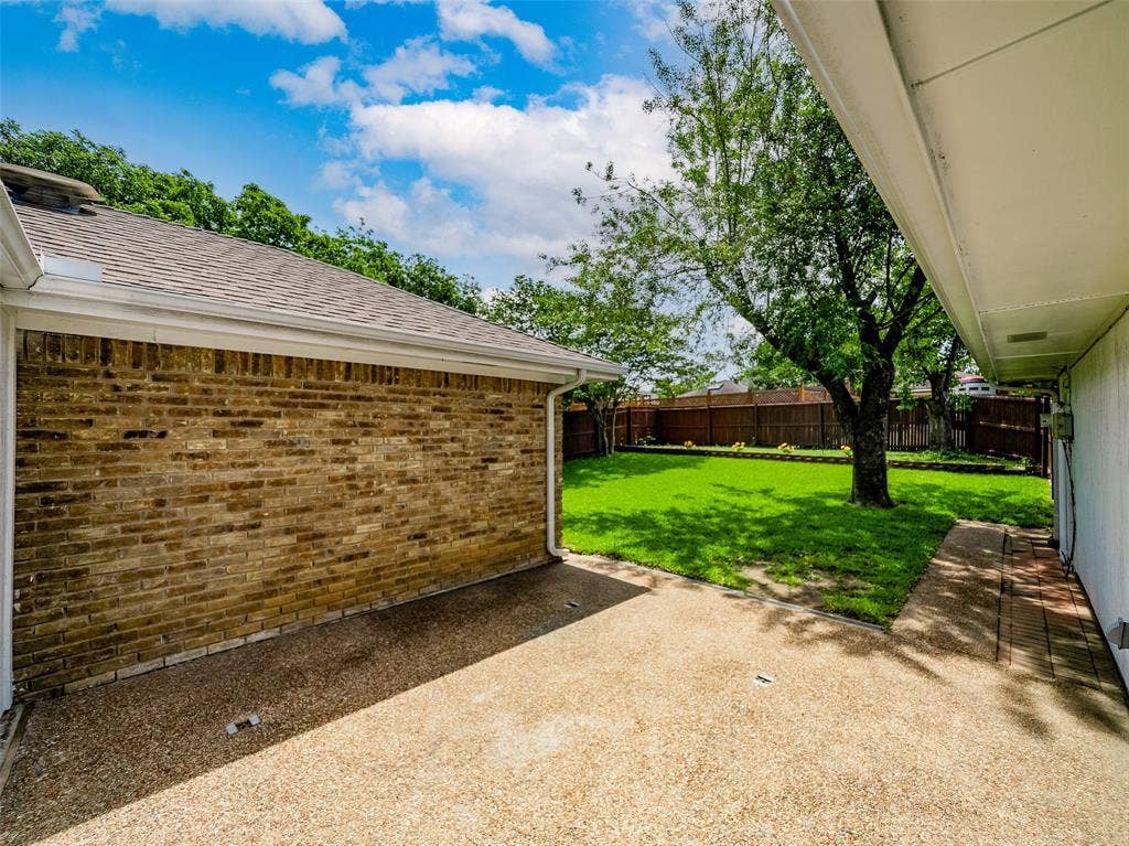 4100 Emerson Drive, Plano, TX 75093 At the end of the patio is a built-in drain that takes water to the side of the property, around the house, and then down to the front of the street.