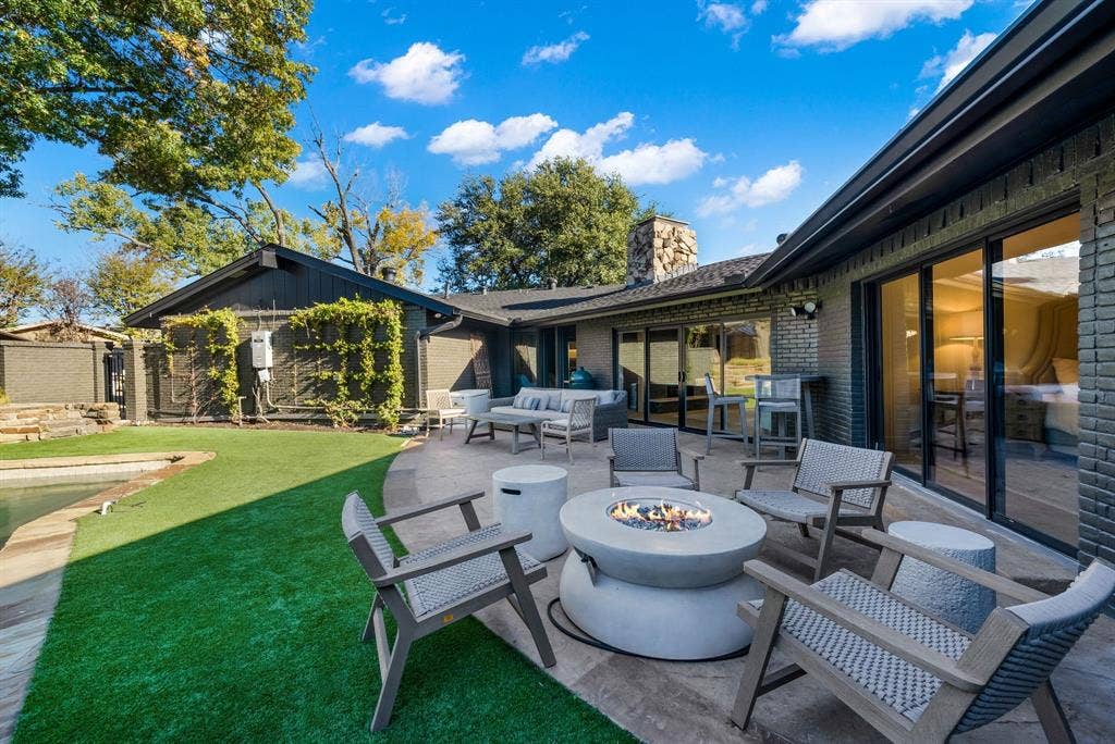 6275 Preston Creek Drive, Dallas, TX 75240 View of patio / terrace with an outdoor living space with a fire pit