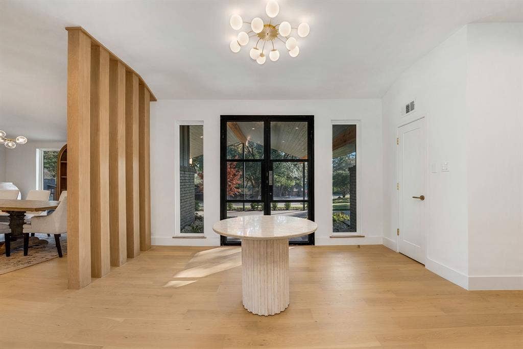 6275 Preston Creek Drive, Dallas, TX 75240 Dining area featuring a chandelier, light wood-style floors, and french doors