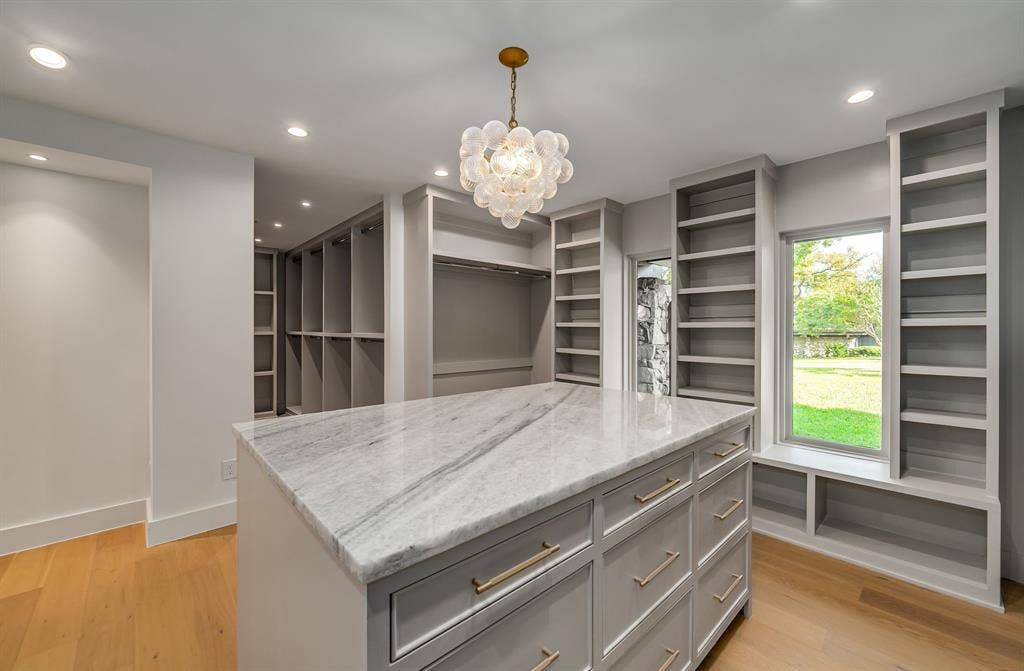 6275 Preston Creek Drive, Dallas, TX 75240 Walk in closet with light wood finished floors and a chandelier