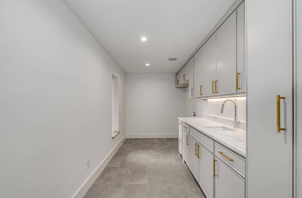 6275 Preston Creek Drive, Dallas, TX 75240 Laundry room featuring cabinet space, recessed lighting, and hookup for a washing machine